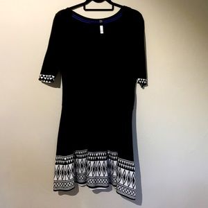 Adorable black knit dress with geometric accents